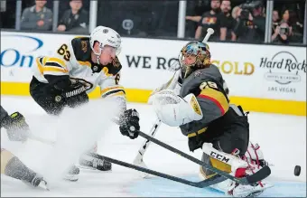  ?? JOHN LOCHER/AP PHOTO ?? Boston Bruins center Brad Marchand (63) attempts a shot on Vegas Golden Knights goaltender MarcAndre Fleury (29) during the third period of Tuesday’s game at Las Vegas.