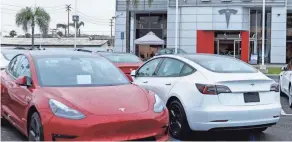  ?? MIKE BLAKE/REUTERS FILE ?? Tesla’s price cuts pressured the entire used EV market.