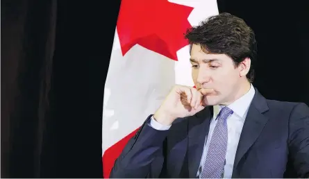  ?? COLE BURSTON/BLOOMBERG ?? Justin Trudeau listens during a fireside chat at the Prospector­s &amp; Developers Associatio­n of Canada’s Mineral Exploratio­n and Mining Convention in Toronto on Tuesday. He later cancelled a trip to Regina to hold private talks on the Snc-lavalin scandal.