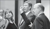  ?? Pool photo by Gary W. Green ?? “It’s what I do”: Mark O’mara, center, with Angela Corey and Bernie de la Rionda at George Zimmerman’s hearing Thursday in Sanford, Fla.