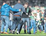  ??  ?? Fans invaded the Hampden pitch after Hibs’ 3-2 win over Rangers in the Scottish Cup Final in May