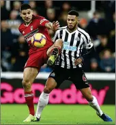  ??  ?? TUSSLE: Mitrovic, on his return to Newcastle, battles for the ball with Toon skipper Lascelles