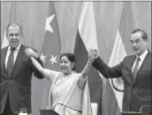  ??  ?? Union Minister for External Affairs Sushma Swaraj with her Chinese counterpar­t Wang Yi and Russian Foreign Minister Sergey Lavrov.