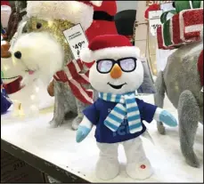  ?? ASSOCIATED PRESS ?? Holiday knick-knacks stand are displayed for Christmas shoppers Friday at a Lowes store in Northglenn, Colo.