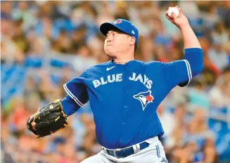  ?? AFP-Yonhap ?? Ryu Hyun-jin of Toronto Blue Jays delivers a pitch to Tampa Bay Rays in the first inning at Tropicana Field in St Petersburg, Fla., Saturday.