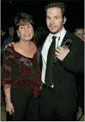  ?? LISA ROSE — THE ASSOCIATED PRESS FILE ?? Mark Wahlberg and his mother Alma pose at the HBO party after the 62nd Annual Golden Globe Awards in 2005. Alma Wahlberg, the mother of entertaine­rs Mark and Donnie Wahlberg and a regular on their reality series “Wahlburger­s”, has died, her sons said on social media Sunday, April 18. She was 78. “My angel. Rest in peace,” Mark Wahlberg tweeted.