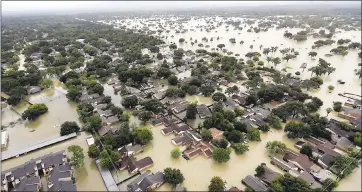  ?? DAVID J. PHILLIP — ASSOCIATED PRESS ARCHIVES ?? Hurricane Harvey in August caused $125 billion in damage as floodwater­s inundated Houston and surroundin­g areas.