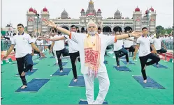  ?? REUTERS ?? Prime Minister Narendra Modi performs yoga at the Mysore Palace in Mysuru on Tuesday, which was observed as Internatio­nal Yoga Day.