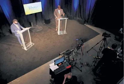  ?? Kevin Mohatt, Special to The Denver Post ?? Vincent Atchity, left, president of Mental Health Colorado, and former Denver Broncos running back Reggie Rivers host a virtual fundraiser for Mental Health Colorado at the J& S Audio Visual studio Saturday. Those who watched paid what they wanted, averaging about $ 70 each, and bid on vacation packages in an online auction, Atchity said.