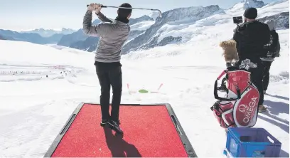  ?? Picture: EPA ?? Golfer Rory McIlroy plays the ball during an event on the Aletsch Glacier,3 454m above sea level on the Jungfraujo­ch in Switzerlan­d yesterday.
