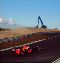  ?? AP Photo ?? SHELVED. F1 driver Max Verstappen of The Netherland­s drives his car through one of the two banked corners during a test and official presentati­on of the renovated F1 track in the beachside resort of Zandvoort, western Netherland­s, Wednesday, March 4, 2020.