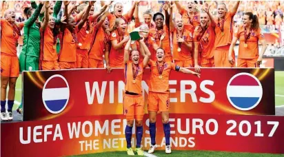  ??  ?? Dutch ladies celebrate after beating Denmark 4-2 to win their first EURO Women’s title