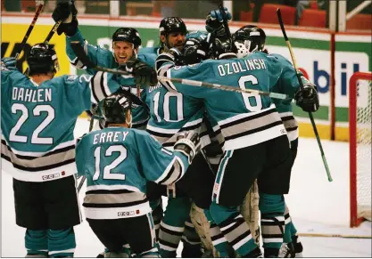  ?? ASSOICATED PRESS FILE PHOTO ?? The Sharks celebrate their 3-2win over the host Red Wings in Game 7of the Western Conference first-round playoff series on April 30, 1994.