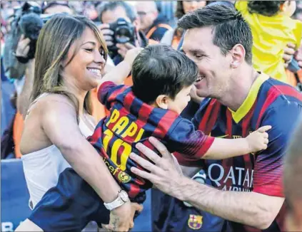  ??  ?? He’s taken: Lionel Messi with son Thiago and fiancée Antonella Roccuzzo. The pair, who have two sons, were due to marry in a star-studded ceremony in his Argentine hometown on Friday. Photo: Albert Gea/Reuters