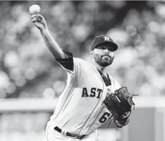  ?? Steve Gonzales / Staff photograph­er ?? Astros rookie righthande­r Jose Urquidy earned his first major league win with seven strong innings against the Rangers on Saturday night at Minute Maid Park. He struck out nine.