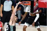  ?? AP Photo/Ashley Landis, Pool ?? ■ Sacramento Kings' Alex Len (25) reacts while dunking on the New Orleans Pelicans during the second half of an NBA basketball game Thursday in Lake Buena Vista, Fla.