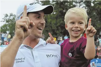  ?? STAFF PHOTOS BY CHRISTOPHE­R EVANS ?? FAMILY AFFAIR: Henrik Stenson celebrates with his 3-year-old son, Karl (above), after shooting a finalround 66 to win the Deutsche Bank Championsh­ip yesterday at TPC Boston. The round included birdie at No. 17 (below), where he holed a shot out of the...