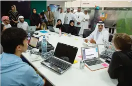  ??  ?? Sheikh Nahyan bin Mubarak Al-Nahyan, Minister of Culture and Knowledge Developmen­t talking to students at Etihad Innovation Week.