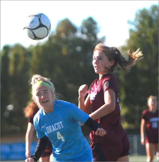  ?? NICOLE GOODHUE BOYD / LOWELL SUN ?? Dracut’s Reese Mcgaffigan, left, and Chelmsford’s Michelle Shoup vie for a loose ball during a 1-1girls soccer game Friday in Chelmsford.