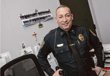  ?? Dave Zajac/Hearst Connecticu­t Media ?? Lt. Hector Cardona stands behind his desk at the Meriden Police Department on West Main Street in Meriden on Jan. 17.