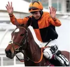  ??  ?? Aidan Coleman celebrates after riding Put The Kettle On to victory