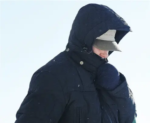  ?? TROY FLEECE / REGINA LEADER- POST ?? Martina Cain, a now-retired teacher accused of holding “strip” basketball drills with a team she coached in La Ronge in the 1980s, covers her face as she leaves the Saskatchew­an Profession­al Teachers Regulatory Board office in Regina.
