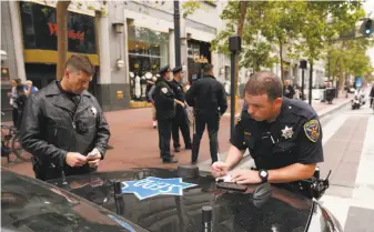  ?? Michael Macor / The Chronicle ?? San Francisco police officers could see their ranks expanded by 225 new members if the Board of Supervisor­s approves Mayor Mark Farrell’s $34.2 million budget proposal.