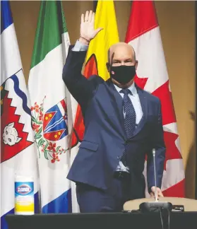  ?? ADRIAN WYLD / THE CANADIAN PRESS ?? Erin O’Toole waves to members of the Conservati­ve national caucus Wednesday, as he gave his first speech as their new leader.