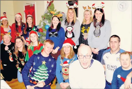  ??  ?? Volunteers from Hinckley and Rugby Building Society organised a festive party for members of Hinckley Mencap’s Thursday Club as part of seasonal celebratio­n challenge championed by charity Leicesters­hire Cares.