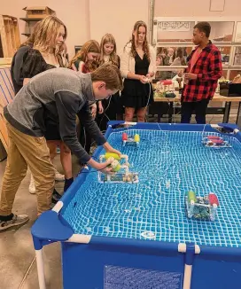  ?? CONTRIBUTE­D ?? Global Impact STEM Academy students provided a live demonstrat­ion as they deployed their ROVS (underwater drone). In addition to testing the maneuverab­ility and adjusting ballasting, students were able to modify their circuit boards and motors to improve their function.