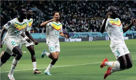  ?? RUNGROJ YONGRIT EPA ?? SENEGAL GLORY: Kalidou Koulibaly celebrates after scoring Senegal’s winner against Ecuador yesterday. |