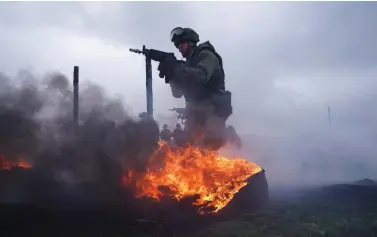  ?? ?? Representa­tional photo: Marines of the Baltic Fleet forces of the Russian Navy train in the zone of obstacles during military exercises at the Khmelevka firing ground in the Kaliningra­d region, Russia, on Wednesday. REUTERS