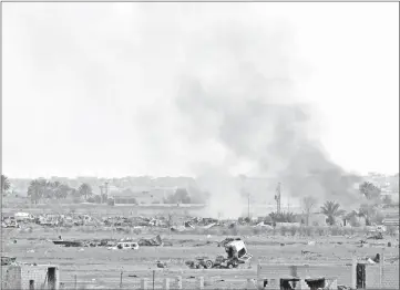  ??  ?? Smoke plumes billow from the remains of an Islamic State (IS) group jihadists’ camp near the village of Baghouz in the eastern Syrian province of Deir Ezzor. — AFP photo