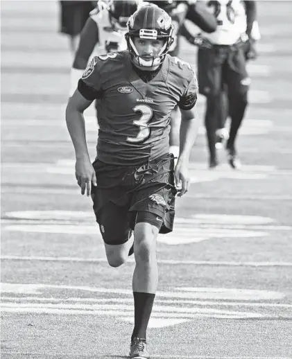  ?? KENNETH K. LAM/BALTIMORE SUN ?? Kicker Kenny Allen, warming up before practice during minicamp at Under Armour Performanc­e Center, knows he doesn’t have much of a chance at sticking with the Ravens, but he’s hoping to learn and eventually catch on with an NFL team.