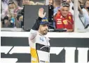  ?? Picture: LARS BARON/GETTY IMAGES ?? IT’S ADIÓS: Fernando Alonso of Spain and McLaren waves from the track at the end of the Abu Dhabi F1 Grand Prix on Sunday.