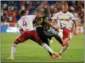  ?? MICHAEL REEVES — FOR DIGITAL FIRST MEDIA ?? Fafa Picault is sandwiched by Red Bulls Tyler Adams (No. 4) and Daniel Royer during Wednesday night’s Open Cup game won by New York in a penalty kick shootout.