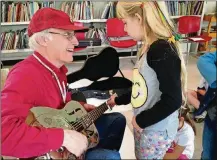  ?? SUBMITTED PHOTO ?? For over 30 years, McCutcheon has been introducin­g children to the family of fretted instrument­s.