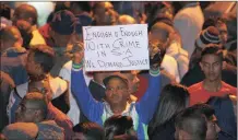  ?? PICTURE: BONGANI MBATHA ?? One of the hundreds of protesters who gathered outside the Chatsworth police station on Monday night.