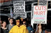  ?? HAMISH McNEILLY/ STUFF ?? Protesters await Prime Minister Chris Hipkins at the University of Otago in Dunedin yesterday.