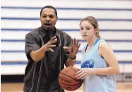  ?? PAT VASQUEZ-CUNNINGHAM/JOURNAL FILE ?? Greg Brown previously coached at the high school level at Bosque School (shown in 2012 with Laura Trost). He has been hired at his alma mater, Albuquerqu­e High.