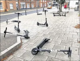  ?? ?? A number of Bird e-scooters were left strewn across Station Road West last month. Cllr Neil Baker says they are a “menace” but Cllr Vall Kenny does not want them removed entirely