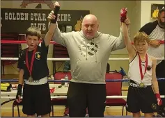  ?? ?? RIGHT:
Golden Star Boxing Club’s Billy Mcelholm (right) at the end of his bout.