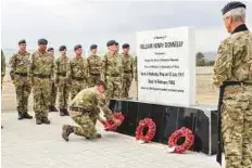  ??  ?? A remembranc­e service was held at Sayh Dhadnah in Fujairah yesterday to mark the death anniversar­y of Sergeant Donnelly.