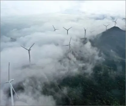  ?? YAO FENG / FOR CHINA DAILY ?? Wind power is widely used as clean energy in Zhoushan, Zhejiang province.
