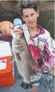  ??  ?? HEALTHY DINNER: Kai Swan with a barramundi caught on a soft plastic prawn bait in a southern river.