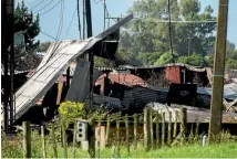  ?? PHOTO: DAVID UNWIN/FAIRFAX NZ ?? Public Health and Worksafe staff were at the destroyed piggery on Monday to investigat­e the types of materials burnt.