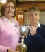  ??  ?? Noeleen Moffatt Lady Captain Carrick on Shannon Golf Club presents The 2016 Garvey Cup to Attracta O’Connor.