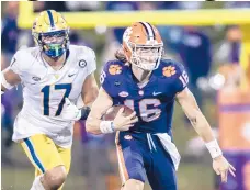  ?? KEN RUINARD/THE INDEPENDEN­T-MAIL ?? Clemson quarterbac­k Trevor Lawrence missed the loss to Notre Dame after testing positive for COVID-19.