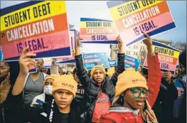  ?? Kent Nishimura Los Angeles Times ?? PEOPLE RALLY OUTSIDE the U.S. Supreme Court to support President Biden’s student debt relief plan on Tuesday as justices heard arguments in two cases.