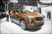  ?? MICHAEL NOBLE JR. / BLOOMBERG ?? The new XT4, geared to appeal to younger buyers, starts at around $35,000 and goes close to $50,000 with options.